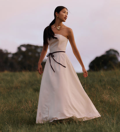 Image of woman in white dress.